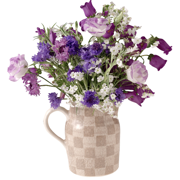 purple florals in a pitcher vase  